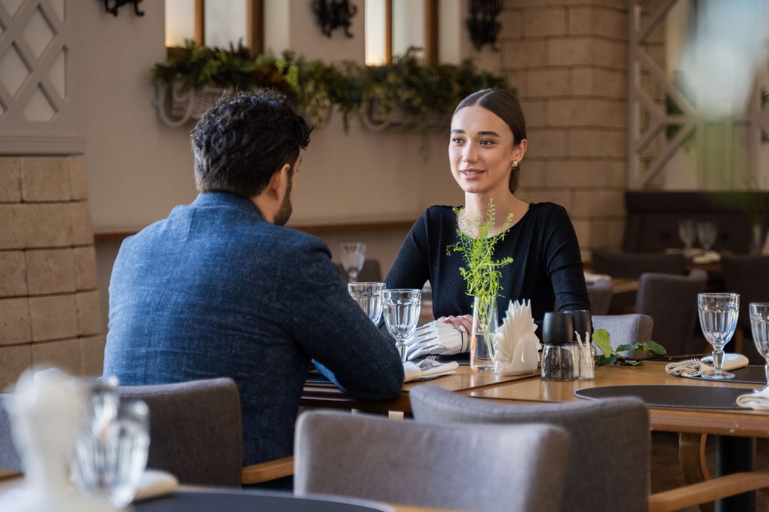 a couple enjoying a conversation in a stylish restaurant 